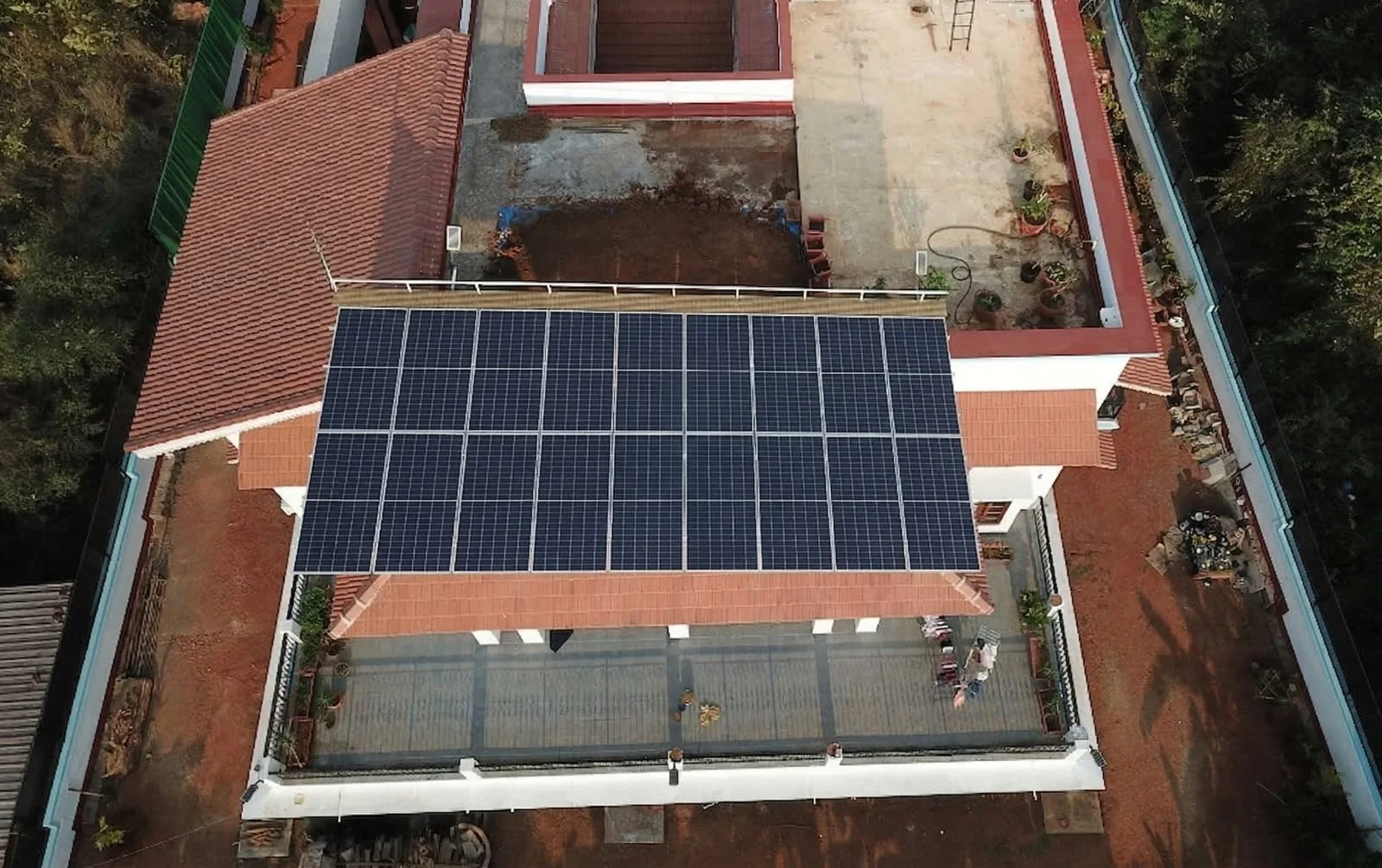 Elevated solar array on a terraced red-roof home